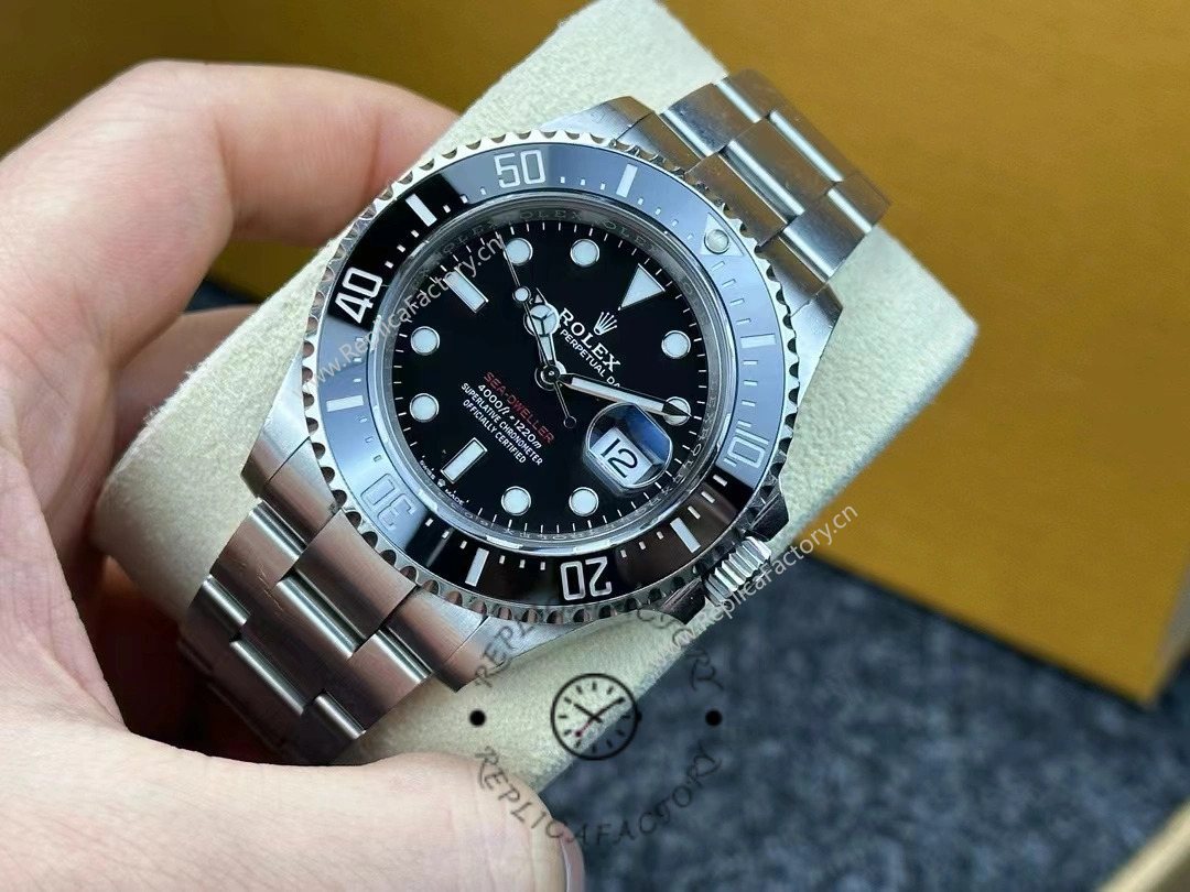 Angled view of Rolex Sea-Dweller 126600-0002 highlighting polished steel bracelet and red Sea-Dweller text.