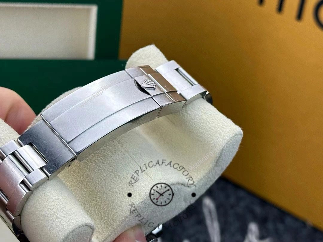 Bracelet clasp of Rolex Sea-Dweller 126600-0002 showing engraved Rolex crown logo.
