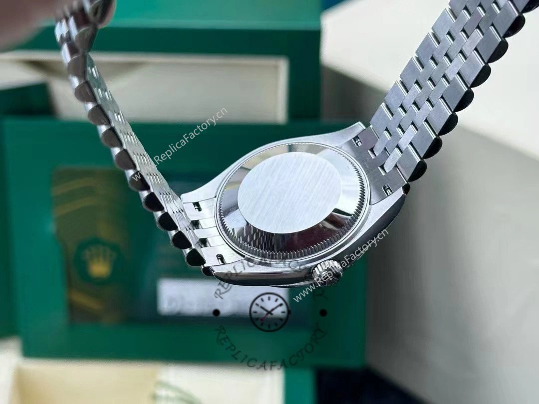 Caseback photo of Rolex Datejust 31mm 278274-0018 after 2 years of real wear, showing brushed steel back and crown detail