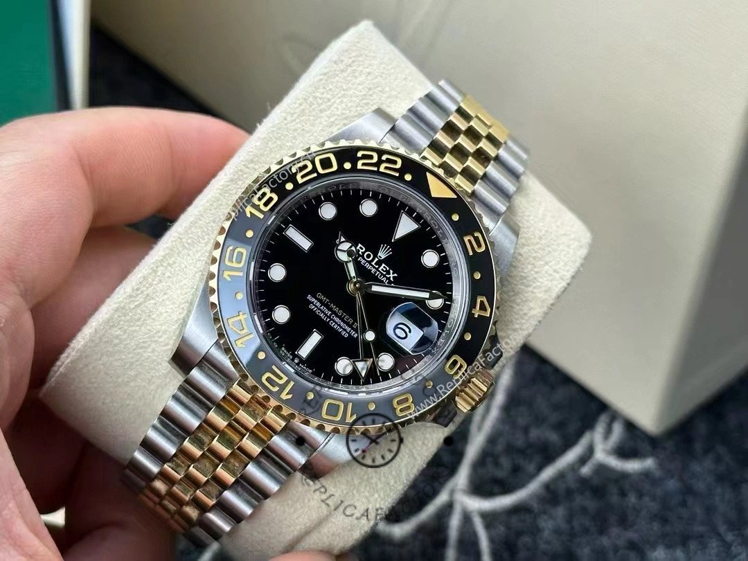 Angled view of Rolex GMT-Master II 126713GRNR-0001 showing luminous hands and gold 24-hour markers.
